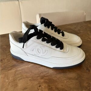 CHANEL White Leather Low-Top Sneakers with Black Laces and Gray Sole Trim
